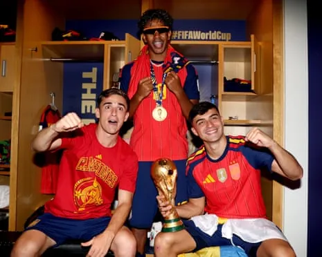 Gavi, Lamine Yamal and Pedri of Spain with the World Cup trophy after victory against Argentina.