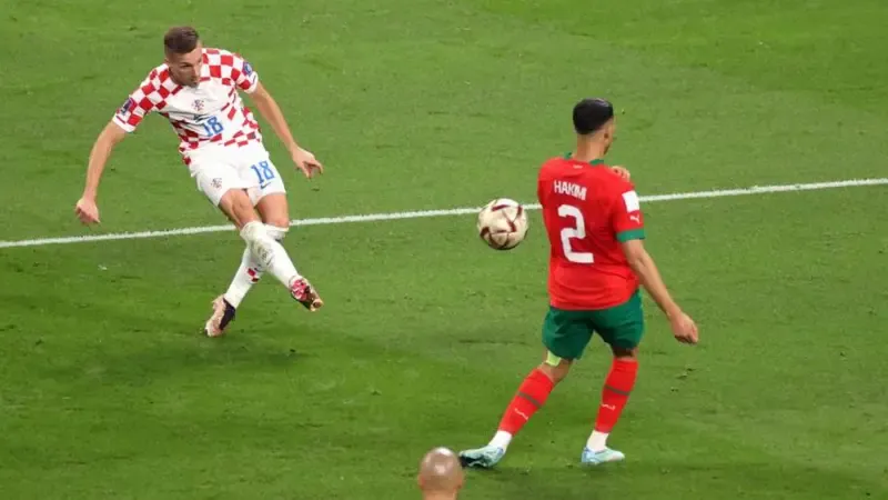 Mislav Orsi strikes the ball for the winner of Croatia's victory over Morocco